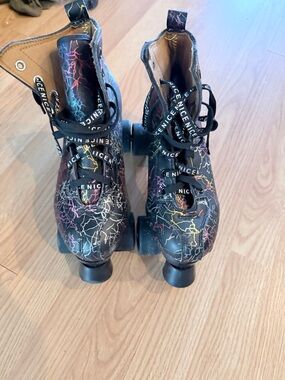 Black Roller Skates with Multicolor Lightning Pattern